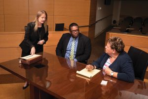 Photo of Professor Mary Kay O’Malley, director of UMKC’s Child and Family Services Clinic, works with students preparing for a hearing.