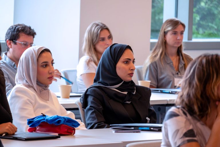 Students listening during a class discussion at American University Washington College of Law. Photo courtesy of “American University Washington College of Law.”