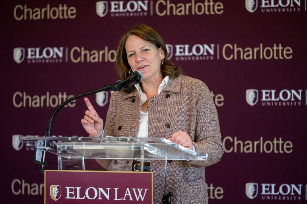 Elon Law President Connie Book speaking at podium at a press conference.
