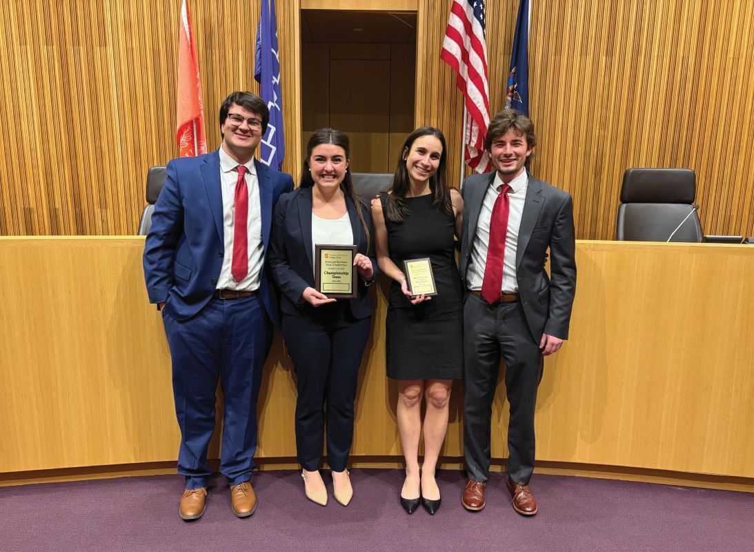 law students standing in a courtroom 