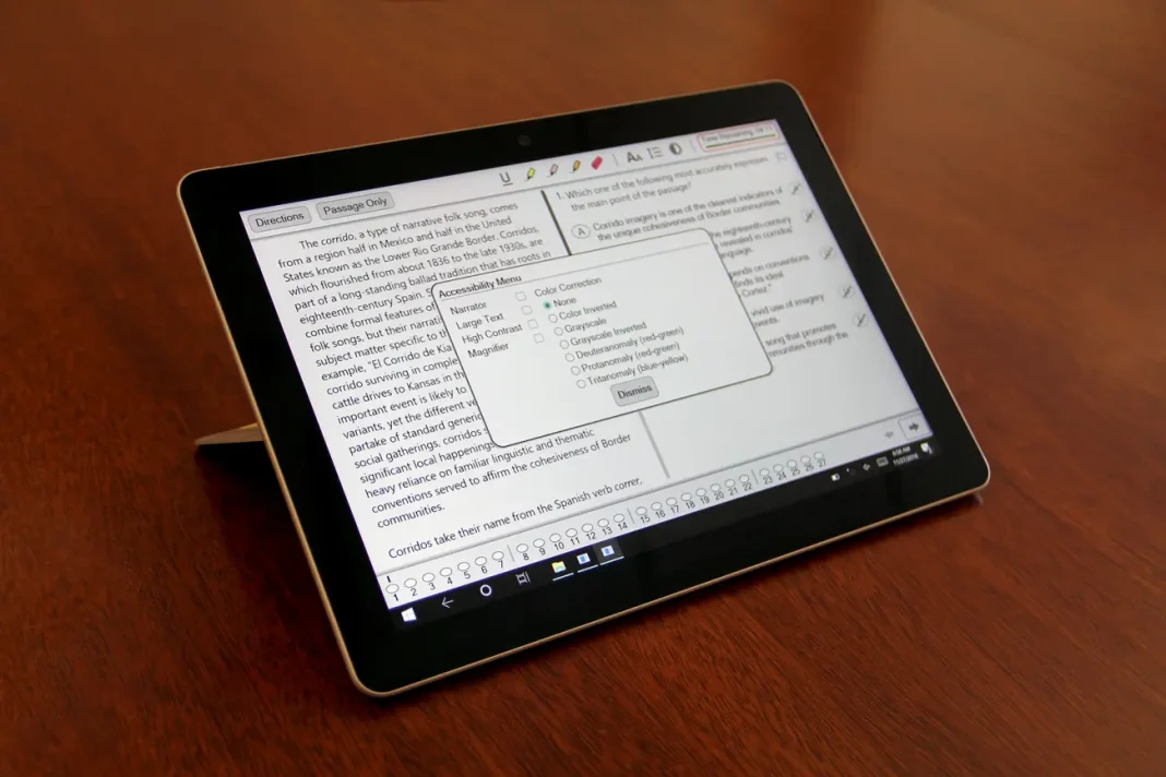 A tablet resting on a wooden surface displaying a reading comprehension or test interface, with highlighted text and an accessibility settings menu open on the screen.