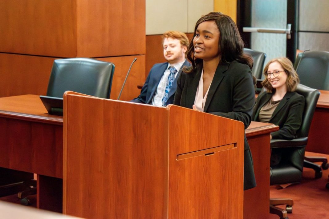 law student at podium speaking at mock trial