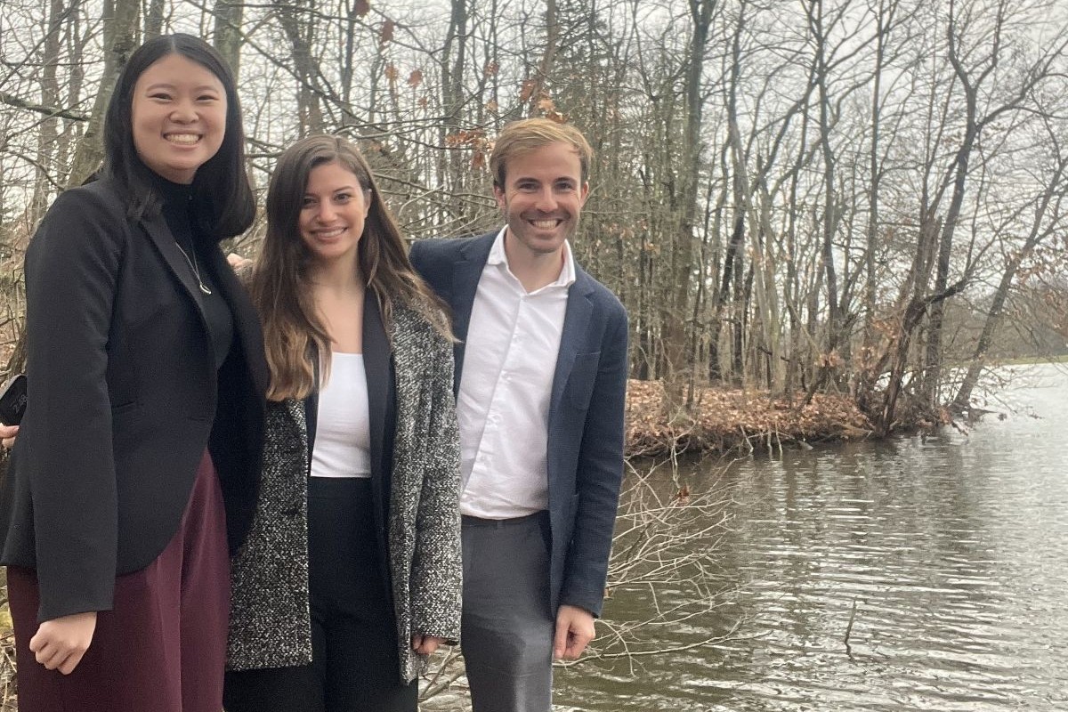 environmental law students standing at lakeside