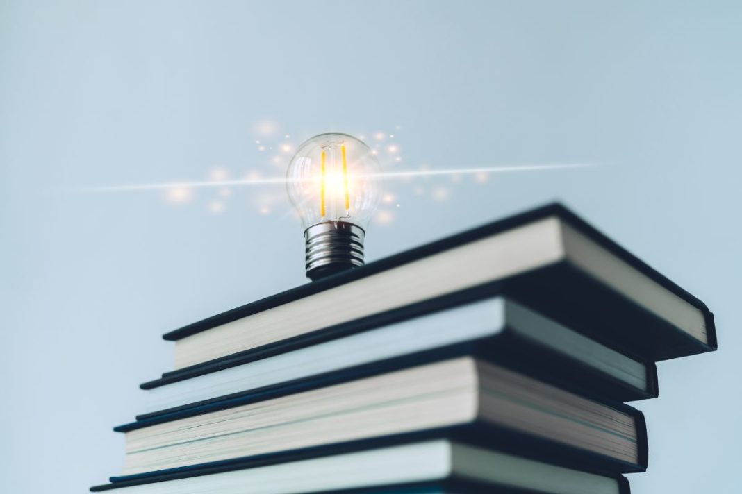 lightbulb on stack of books