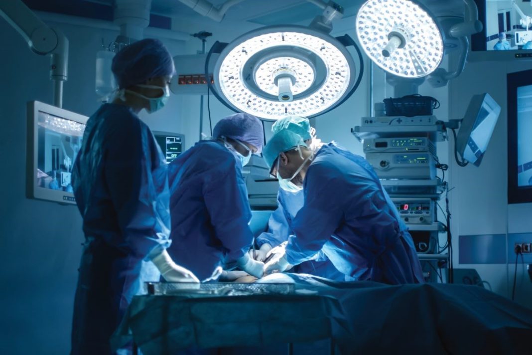 doctor and nurses in operating room