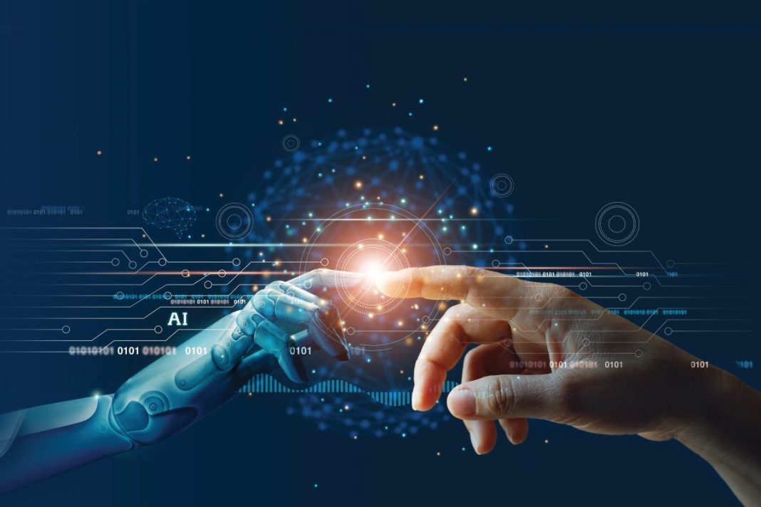 human hand with robot hand depicting AI