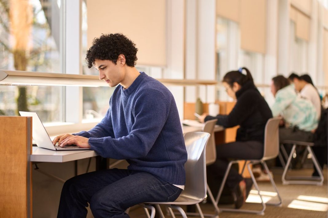 students in library study space in college