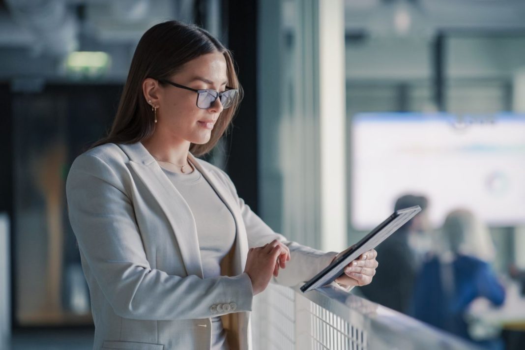 professional businesswoman looking at a tablet